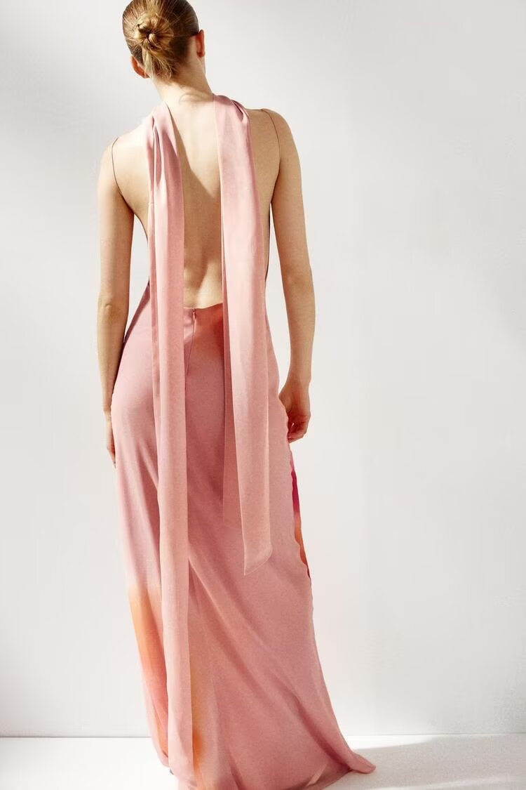 Back Elegant polyester maxi dress with zipper and scarf elements.